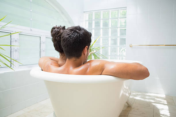 istock Attractive couple enjoy a bath together 497131609