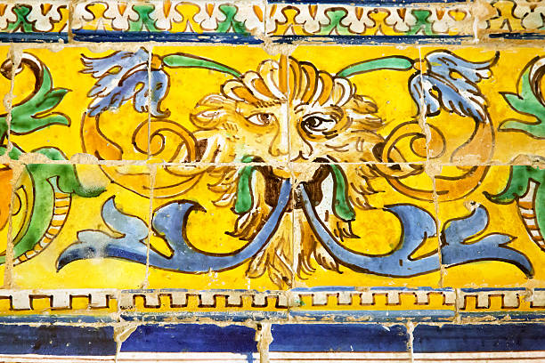Detail of azulejos in Reales Alcazares, Sevilla Detail of a strange face in old azulejos of Reales Alcazares, Sevilla alcazares reales of sevilla stock pictures, royalty-free photos & images