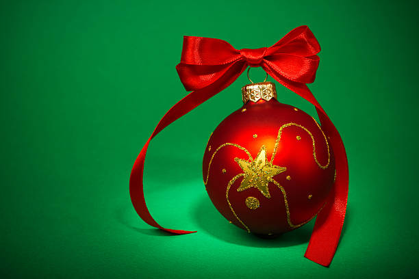 istock Red Christmas ball on green background 497141697