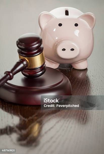 Gavel And Piggy Bank On Table Stock Photo - Download Image Now - Authority, Coin Bank, Control