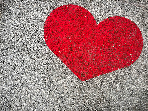 istock heart shaped painting on cement floor 497142314