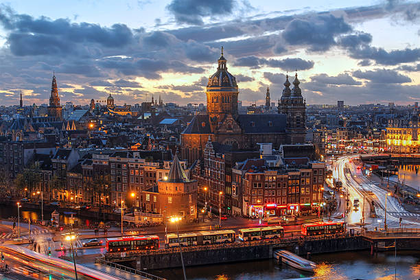 Amsterdam, Netherlands Aerial view of downtown Amsterdam, The Netherlands during a dramatic beautiful sunset. Almost all of the most proeminent landmarks are visible. amsterdam stock pictures, royalty-free photos & images