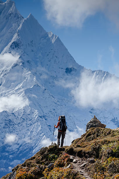Hiker walks on train in Himalayas