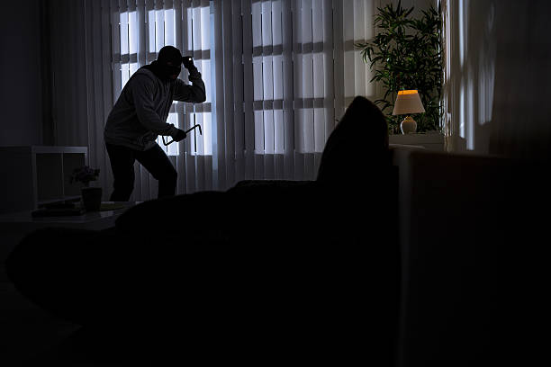 istock burglary with crowbar breaking into a home 497144260