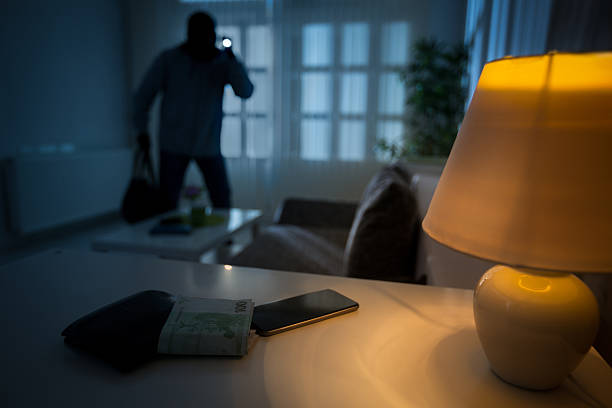 burglar in a house inhabited intrusion of a burglar in a house inhabited burglary stock pictures, royalty-free photos & images