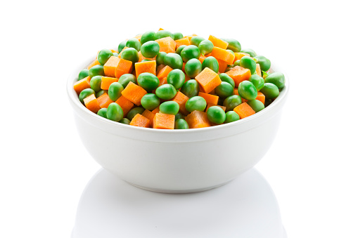 Green Peas and Carrot Heap Isolated on White Background
