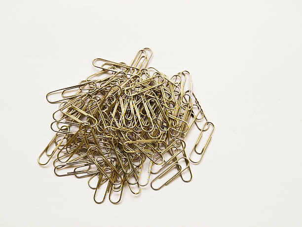 istock Used Paper clips isolated on  white background 497145429