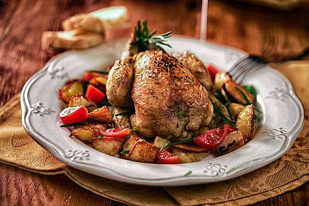 istock Cockerel baked with potatoes and tomatoes 497146311