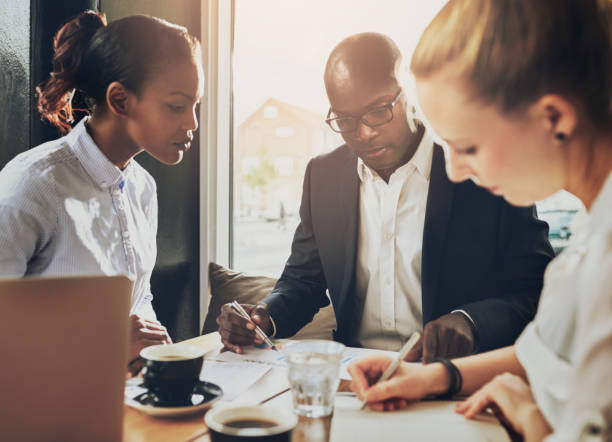 istock Serious group of business people working 497147072