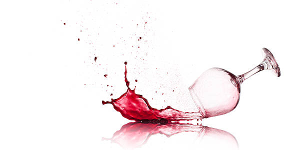 Spilled Red Wine Red Wine Glass spilling and splashing. wine glass knocked over stock pictures, royalty-free photos & images