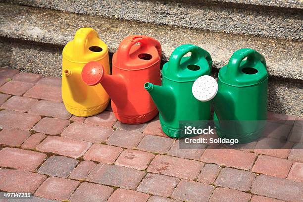 Watering Cans Ready For Service Stock Photo - Download Image Now - Brick, Color Image, Copy Space