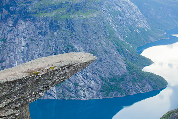 Famous norwegian rock hiking place - trolltunga, trolls tongue, Norway norway, nature, trolltunga, fjord, mountain, landscape, oslo, tongue, troll, hiking, norge, scandinavia, odda, summer, fjords, norwegian, lake, rock, iceland, reykjavik, ringedalsvatnet, hardanger, scandinavian, oslofjord, roldal, sognefjord, beautiful, blue, tourism, nordic, hardangervidda, prekestolen, preikestolen, kjerag, briksdal, Eidfjord, hordalann, Sognefjord, Hardangerfjord, Lysefjord, Geirangerfjord, Nordfjord, Oslofjord, Fjord Norway, Kjeragbolten, Pulpit Rock, Trollstigen, Voringsfossen, Vibrant, norway lysefjorden fjord norwegian currency stock pictures, royalty-free photos & images