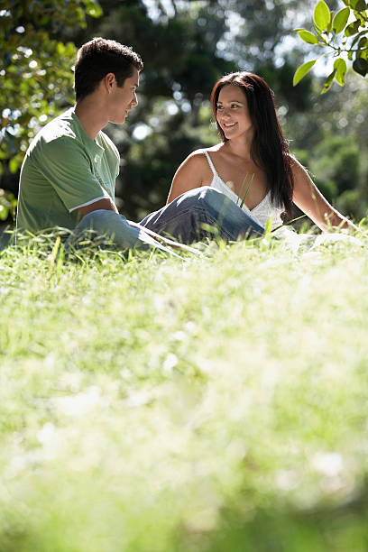 istock Couple Looking At Each Other In Park 497147947