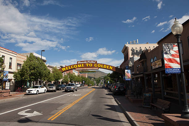 Washington Avenue in Golden Colorado With it's "Welcome to Golden" sign over Washington Avenue, the old west lives on in Golden, Colorado with its historic Victorian stores, bars and apartment buildings lining the road. colorado photos stock pictures, royalty-free photos & images