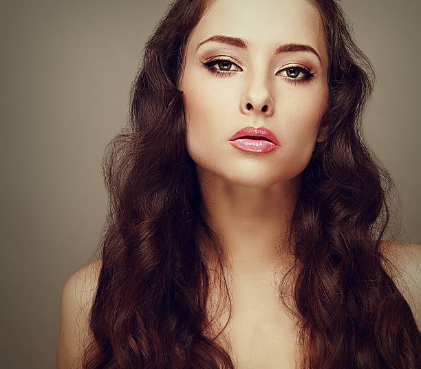 istock Beautiful makeup woman with long curly hair 497148401
