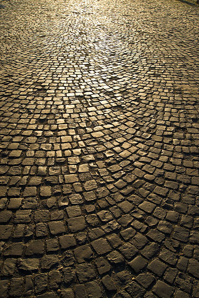 istock Cobbled street with reflection of light 497148589