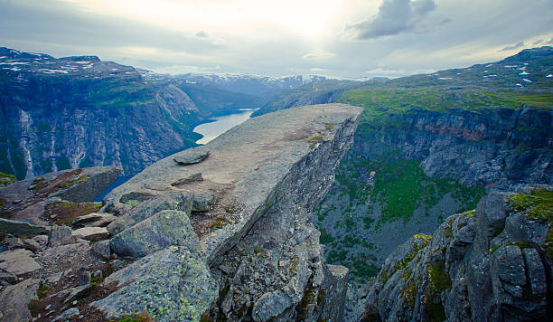 Famous norwegian rock hiking place - trolltunga, trolls tongue, Norway norway, nature, trolltunga, fjord, mountain, landscape, oslo, tongue, troll, hiking, norge, scandinavia, odda, summer, fjords, norwegian, lake, rock, iceland, reykjavik, ringedalsvatnet, hardanger, scandinavian, oslofjord, roldal, sognefjord, beautiful, blue, tourism, nordic, hardangervidda, prekestolen, preikestolen, kjerag, briksdal, Eidfjord, hordalann, Sognefjord, Hardangerfjord, Lysefjord, Geirangerfjord, Nordfjord, Oslofjord, Fjord Norway, Kjeragbolten, Pulpit Rock, Trollstigen, Voringsfossen, Vibrant, norway lysefjorden fjord norwegian currency stock pictures, royalty-free photos & images