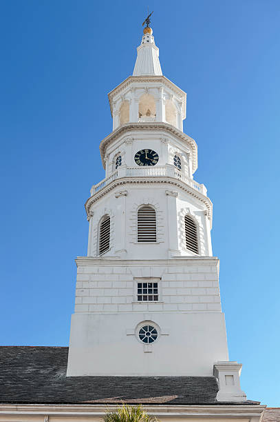 istock Old church steeple against blue sky 497150962