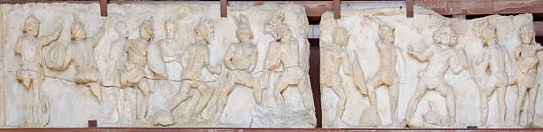 The Colosseum, or Coliseum, in Rome, Italy is always an architectural wonder to behold, and here is a perfect example of the amazing design that still stands today.  Pictured here is a marble relief saved from destruction inside the Colosseum.  Construction started in 72 A.D. by Vespasian, with modifications added by Titus and Domician, the three Roman Emperors from the Flavian dynasty - hence the structure is also known as the Flavian Amphitheater.  Holding up to 80,000 people, the Colosseum was used for gladiator fights, to showcase the Navy with battleships in water, animal hunts, and in later years as apartments. This iconic structure still stands, despite repurposing much of the marble and stone for buildings across Rome.  Today it is one of the most visited tourist attractions in the city.
