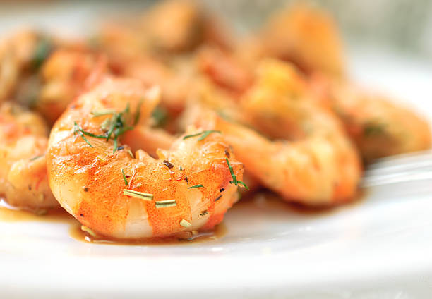 istock Fried black tiger prawns with herbs and spices. 497152088
