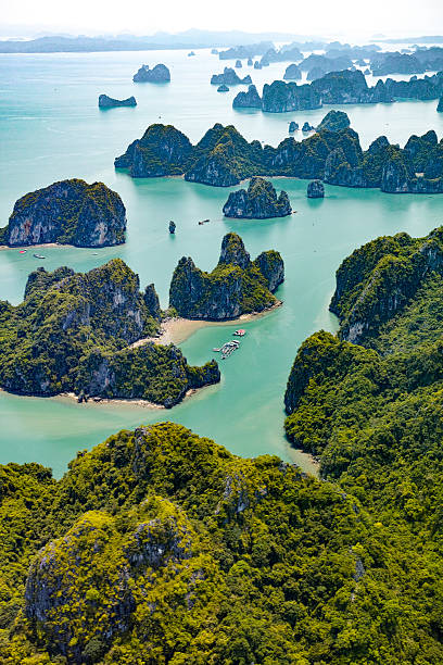 Islands of Ha Long Bay, Vietnam Islands of Ha Long Bay, Vietnam gulf of tonkin photos stock pictures, royalty-free photos & images
