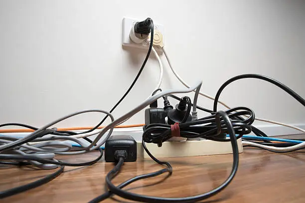 Overloaded power board in home office