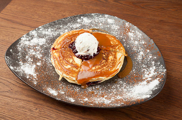 istock pancakes with ice cream and topped with blueberries 497154610