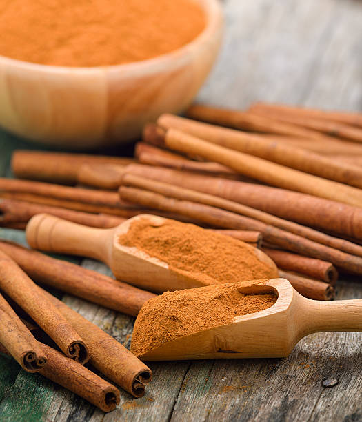 istock Cinnamon sticks and powder cinnamon in the bowl on table 497155084