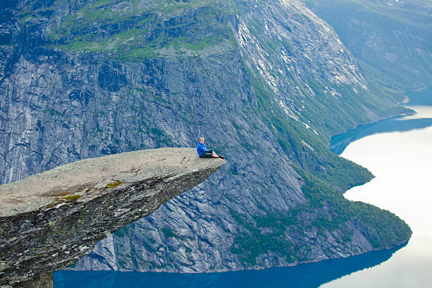 Famous norwegian rock hiking place - trolltunga, trolls tongue, Norway norway, nature, trolltunga, fjord, mountain, landscape, oslo, tongue, troll, hiking, norge, scandinavia, odda, summer, fjords, norwegian, lake, rock, iceland, reykjavik, ringedalsvatnet, hardanger, scandinavian, oslofjord, roldal, sognefjord, beautiful, blue, tourism, nordic, hardangervidda, prekestolen, preikestolen, kjerag, briksdal, Eidfjord, hordalann, Sognefjord, Hardangerfjord, Lysefjord, Geirangerfjord, Nordfjord, Oslofjord, Fjord Norway, Kjeragbolten, Pulpit Rock, Trollstigen, Voringsfossen, Vibrant, norway, nature, trolltunga, fjord, mountain, landscape, oslo, tongue, troll, hiking, norge, scandinavia, odda, summer, fjords, norwegian, lake, rock, iceland, reykjavik, ringedalsvatnet, hardanger, scandinavian, oslofjord, roldal, sognefjord, beautiful, blue, tourism, nordic, hardangervidda, prekestolen, preikestolen, kjerag, briksdal, Eidfjord, hordalann, Sognefjord, Hardangerfjord, Lysefjord, Geirangerfjord, Nordfjord, Oslofjord, Fjord Norway, Kjeragbolten, Pulpit Rock, Trollstigen, Voringsfossen, Vibrant, norway lysefjorden fjord norwegian currency stock pictures, royalty-free photos & images