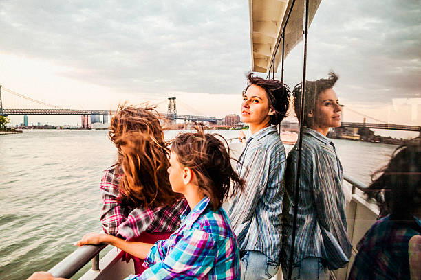 istock Mother and two daughters at ferry at Hudson River 497155915