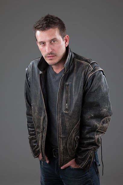 istock Adult male with serious expression wearing leather jacket 497156564
