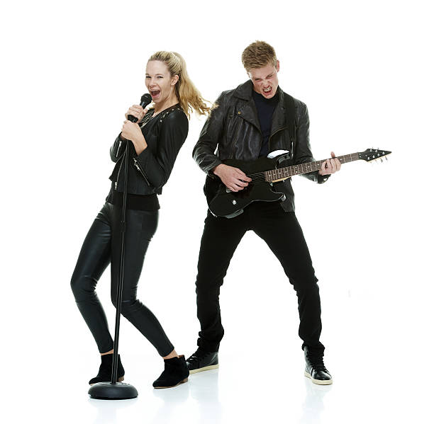 dos alegre tocando la guitarra - isolated on white studio shot guitar young men fotografías e imágenes de stock