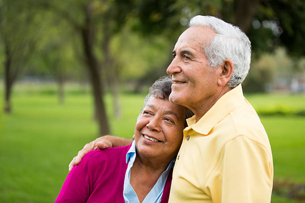 istock Senior couple holding each other in the park 497157059