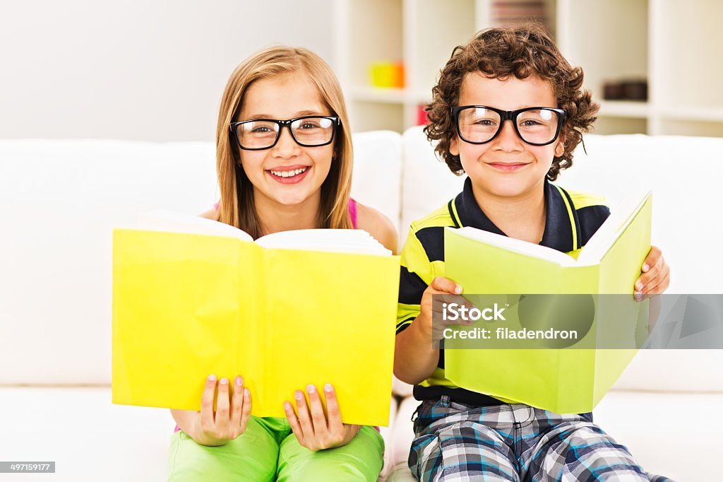 Reading a book at home Child Stock Photo