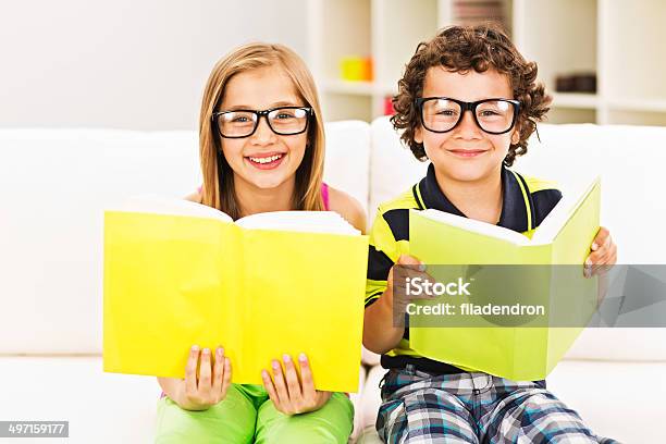 Reading A Book At Home Stock Photo - Download Image Now - Child, Nerd, Reading