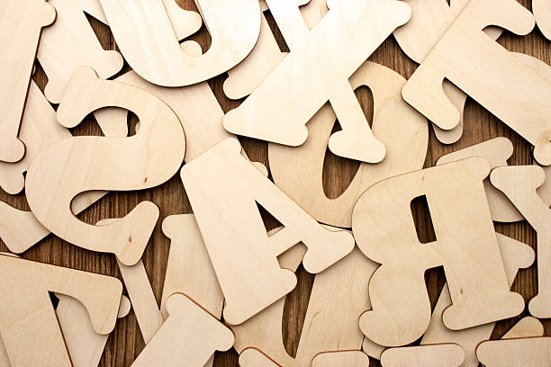 istock English alphabet (upper case) on vintage wood background 497159675