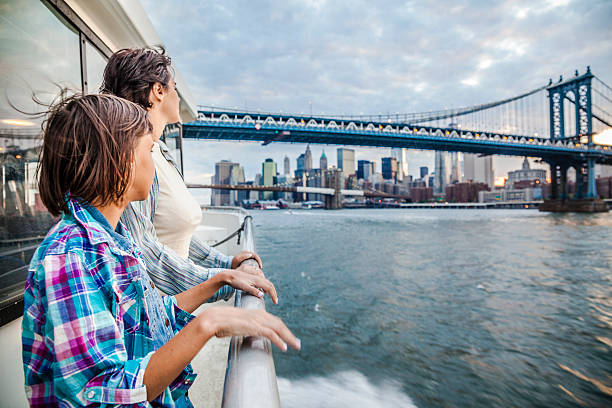 istock Mother and daughter at ferry at Hudson River 497161061