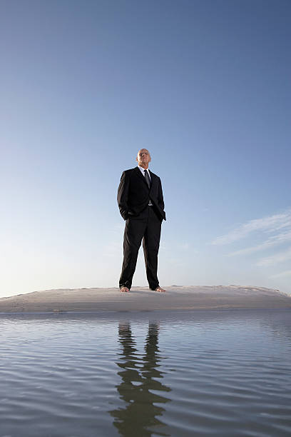 istock Businessman Standing in the Sand 497161441