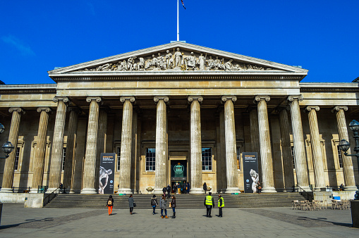 London, UK - March 23, 2015: The British Museum in central London. Photo taken outside and contains several museum-goers.