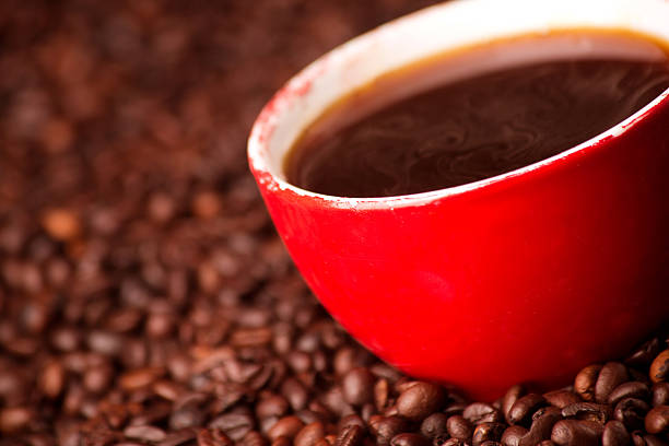 istock Red cup of espresso on the coffee beans background 497179855