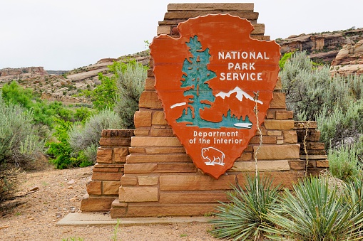 Fruita, Colorado, USA - May 21, 2014: Sign of the National Park Service at the entrance of the Colorado National Monument.