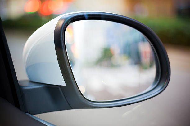 istock Car Side Rear-View Mirror with City Street View Reflection 497180788