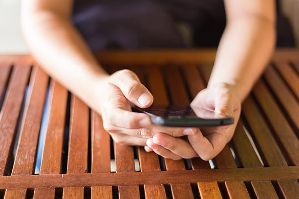istock Woman Using the Smartphone for Business at Cafe 497181114
