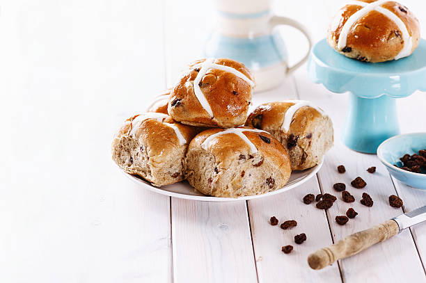 istock Easter cross-buns on a white wooden background 497182226