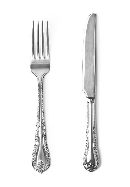 vintage tenedor y cuchillo sobre fondo blanco - nobody table knife food dinner fotografías e imágenes de stock