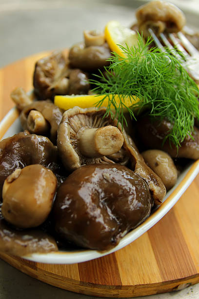 istock Mushrooms, marinated and seasoned with spices ready for food. 497184681