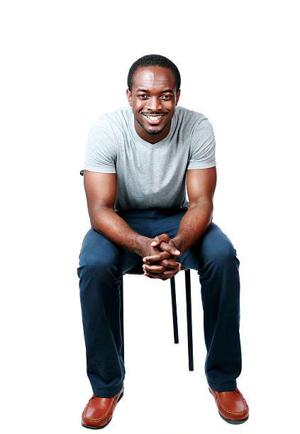 istock happy african man sitting on the chair 497185893