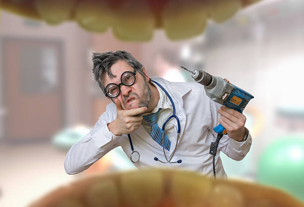 View from mouth on crazy unsure dentist doctor with drill
