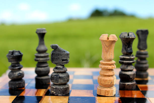 istock Image of chessboard game / wooden chess set against sky, boardgame 497186803