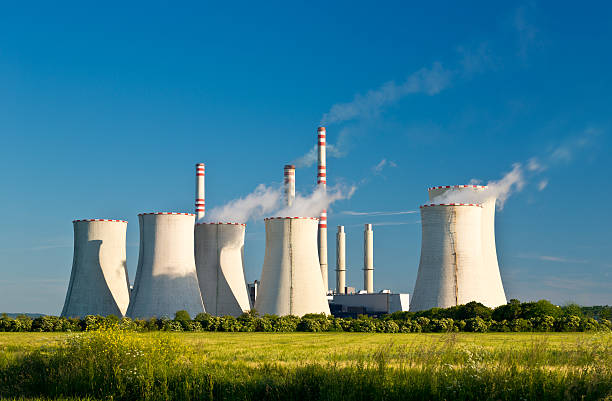 istock Power station in field under blue sky 497187219